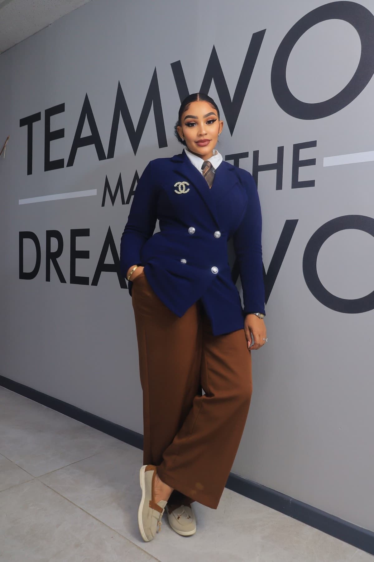 Zari in a navy blazer at her office